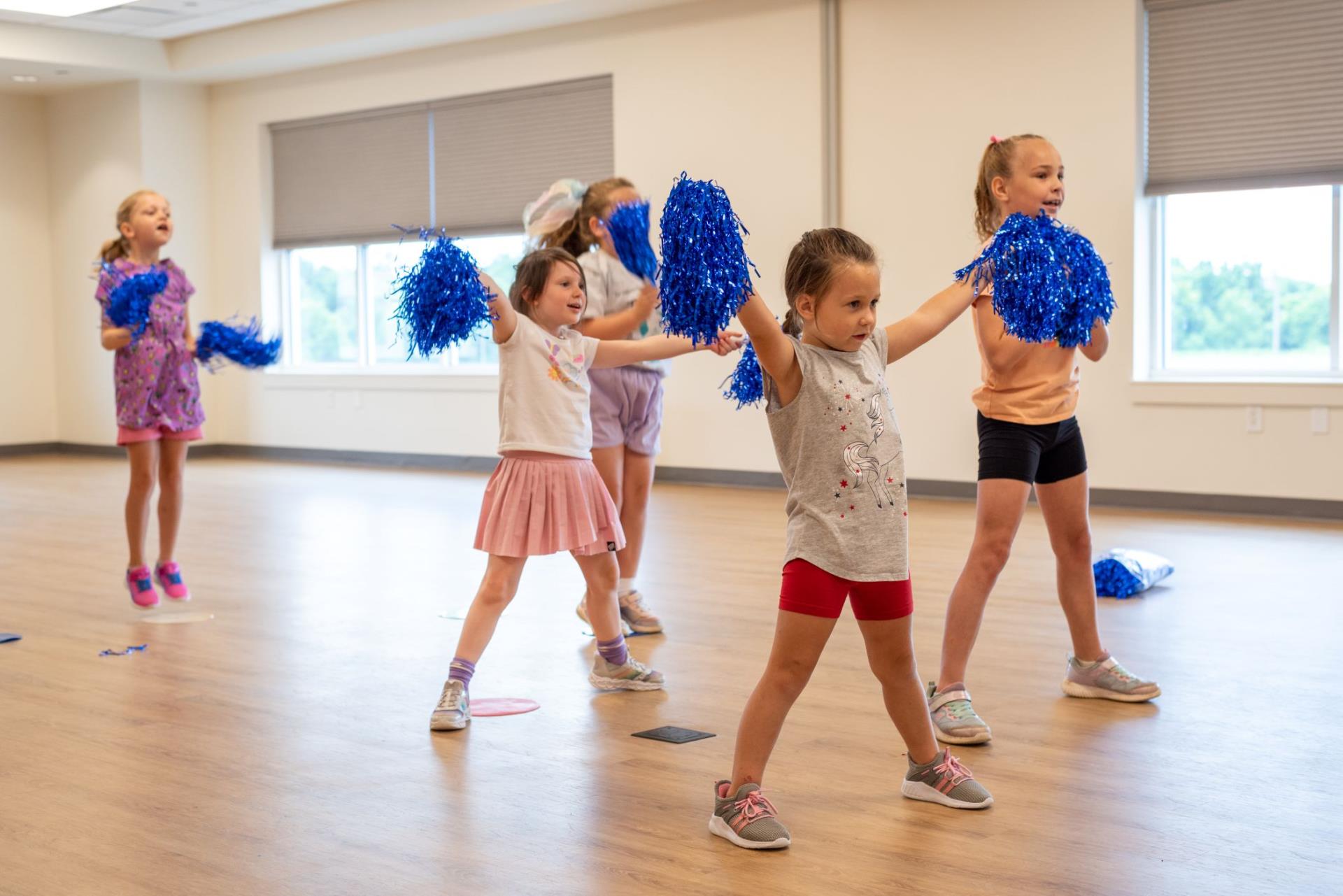 Young children participating in a Cheerleading routine during a class held through Augusta County Parks and Recreation.