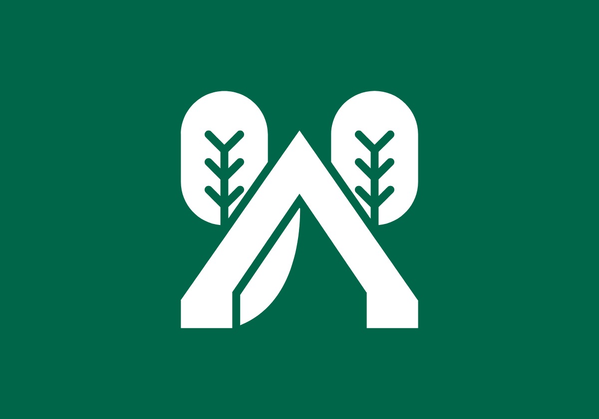 white tent and trees icon on green background